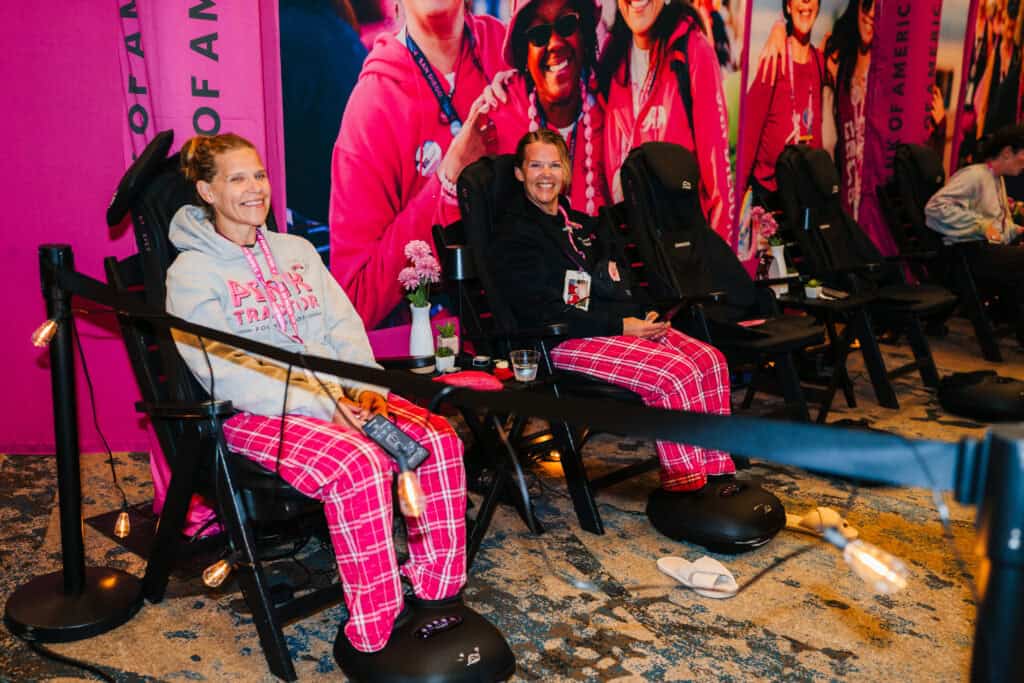Walkers relaxing in the massage chairs at the Bank of America lounge at the 2026 Susan G. Komen Dallas/Fort Worth 3-Day.
