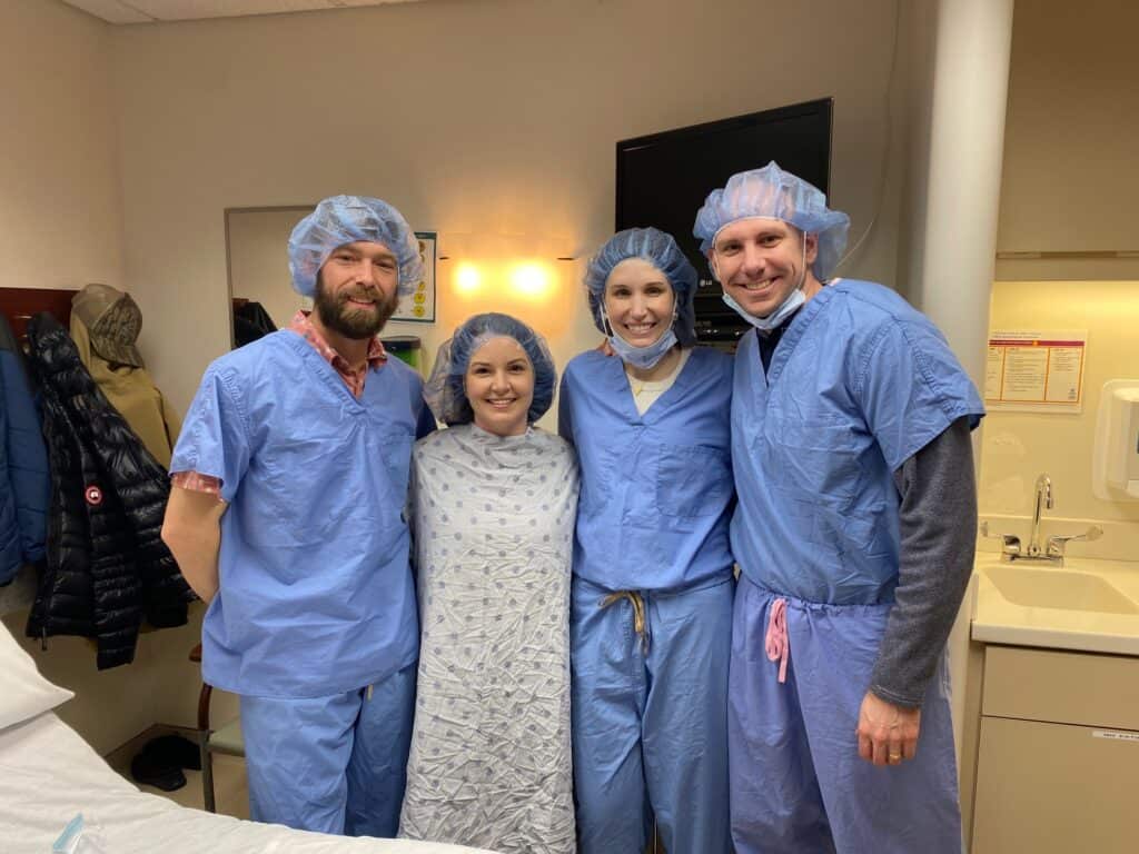 Breast cancer survivor Alex with her husband, her surrogate and her husband. 