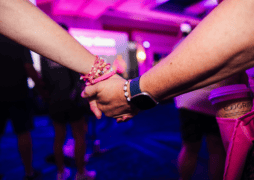 Attendees at the 2026 Susan G. Komen Boston 3-Day holding hands at Opening Ceremony on Day 1.