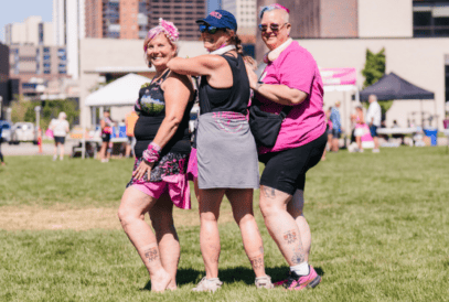 Alisen, Julie and Karen showing off their 3-Day tattoo at the 2025 Denver 3-Day.