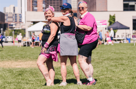Alisen, Julie and Karen showing off their 3-Day tattoo at the 2025 Denver 3-Day.