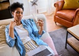 Menopausal,Mature,Woman,At,Home,With,Laptop,Having,Hot,Flush