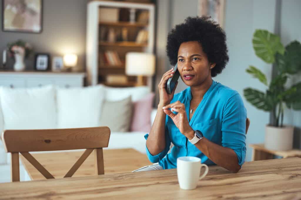Making,Call.,Portrait,Of,Cheerful,Black,Woman,Talking,On,Cellphone