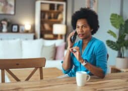 Making,Call.,Portrait,Of,Cheerful,Black,Woman,Talking,On,Cellphone