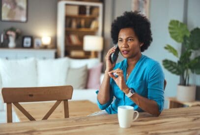 Making,Call.,Portrait,Of,Cheerful,Black,Woman,Talking,On,Cellphone
