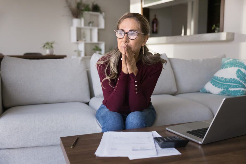 Woman pensive anxious on couch