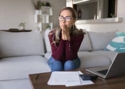 Woman pensive anxious on couch