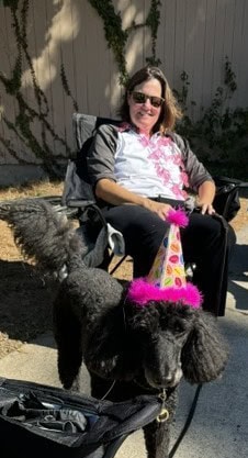 Susan's dog, Misty, and her neighbor on Juan Street during the San Diego 3-Day.
